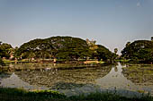 Thailand - Old Sukhothai - Wat Sorasak. The chedi is in a beautiful  area with lots of trees and a large reservoir.